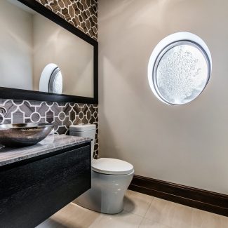 Contemporary bathroom with hidden drawers and handles.
