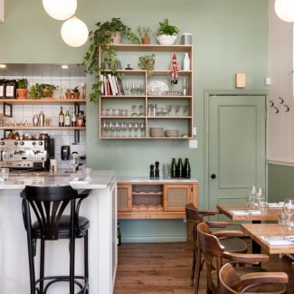 Rustic Kitchen with light countertops and white cabinets.