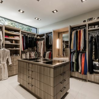 Custom wardrobe design for storing clothing and personal items.