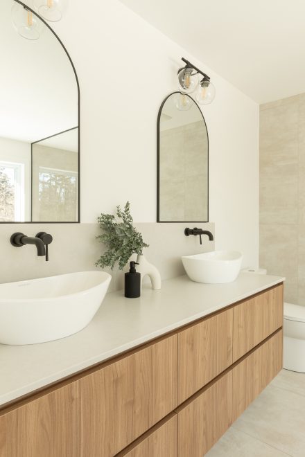 Custom made vanity from Atleliers Jacob with oak wood, and oval mirror