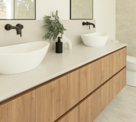 Custom made vanity from Atleliers Jacob with oak wood, and oval mirrors