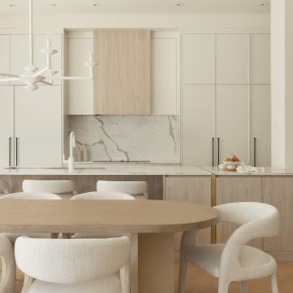 Cuisine de Véronique Cloutier avec électroménagers intégrés et hotte dissimulée derrière des armoires sur mesure signées Ateliers Jacob.