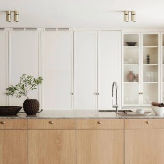 Cuisine farmhouse de Nordiska Kök avec un ilôt en granit et bois